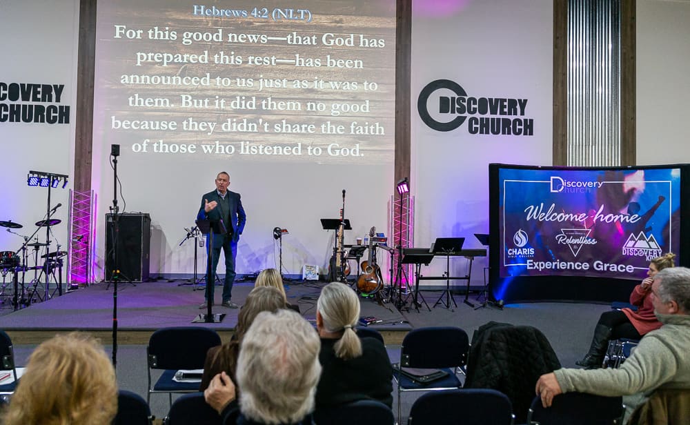 Stephen McIntosh with congregation